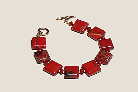 Genuine poppy red jasper bracelet with goldtoned toggle clasp