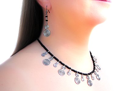 Steel spirals with black glass necklace-earring set